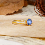 Timeless ClassicRound Cut Sapphire Side Stone Engagement Ring - Additional view