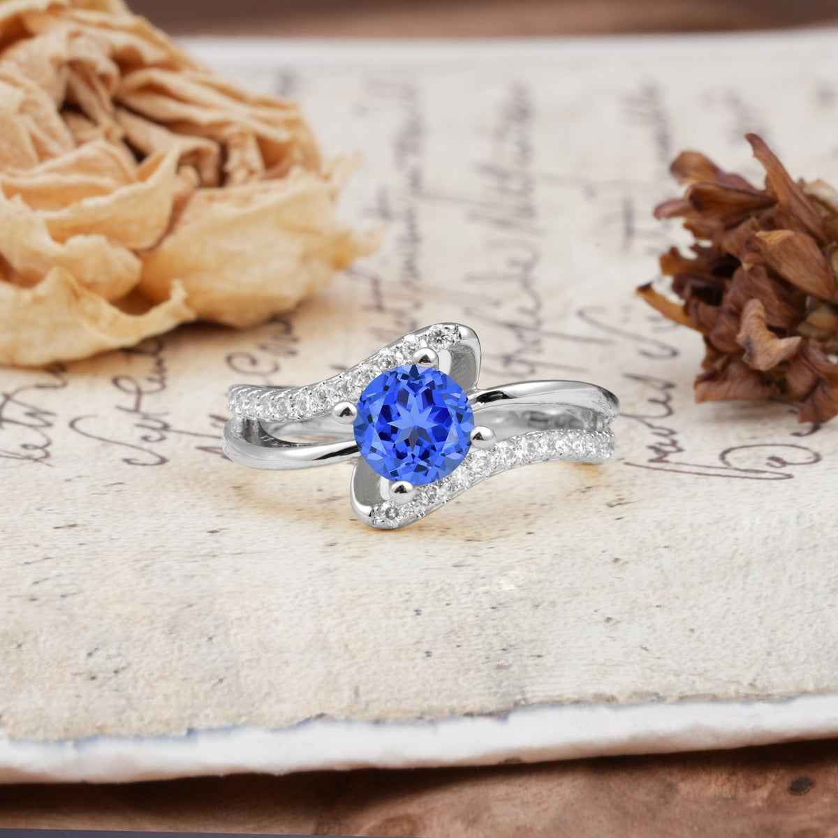 Uniquely Elegant, Twisting 4-Prong Round Cut Sapphire Engagement Ring - Additional view
