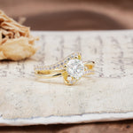 Uniquely Elegant, Twisting 4-Prong Round Cut Moissanite Engagement Ring - Additional view