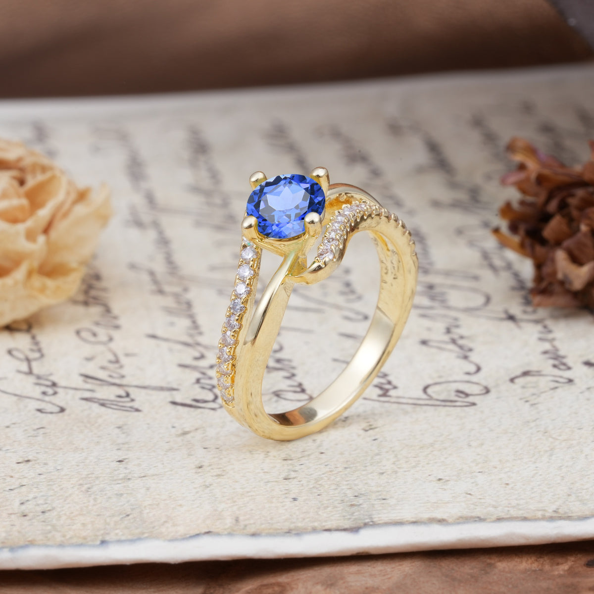 Uniquely Elegant, Twisting 4-Prong Round Cut Sapphire Engagement Ring - Additional view