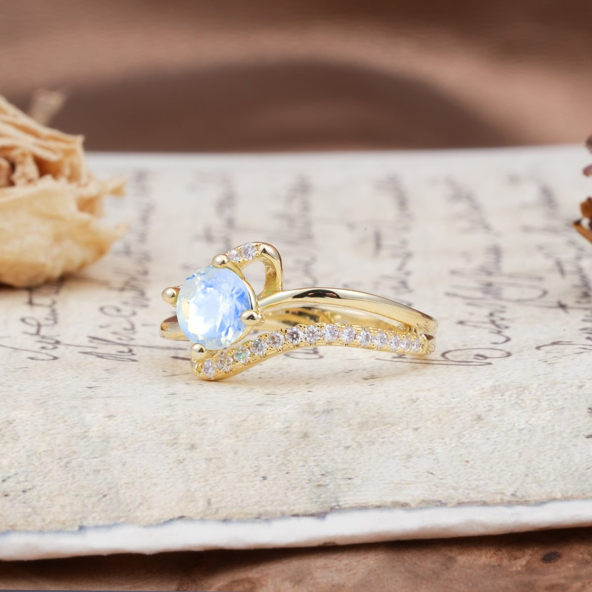 Uniquely Elegant, Twisting 4-Prong Round Cut Moonstone Engagement Ring - Additional view