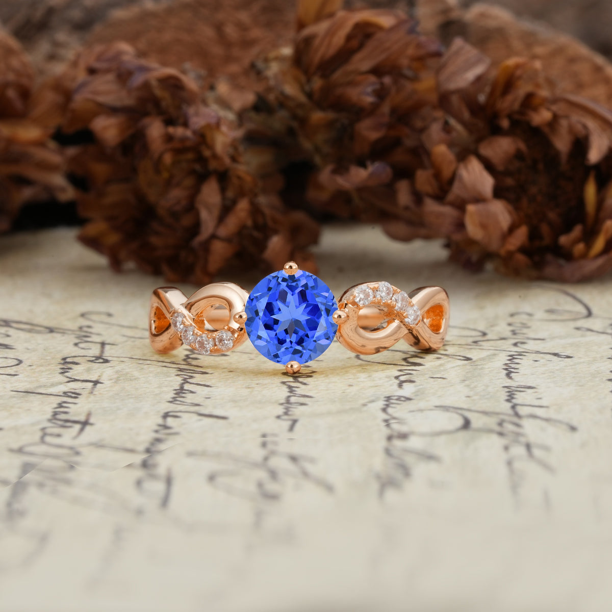 Unique, Luxurious, Twisted-Cross 4-Prong Round Cut Sapphire Engagement Ring - Additional view