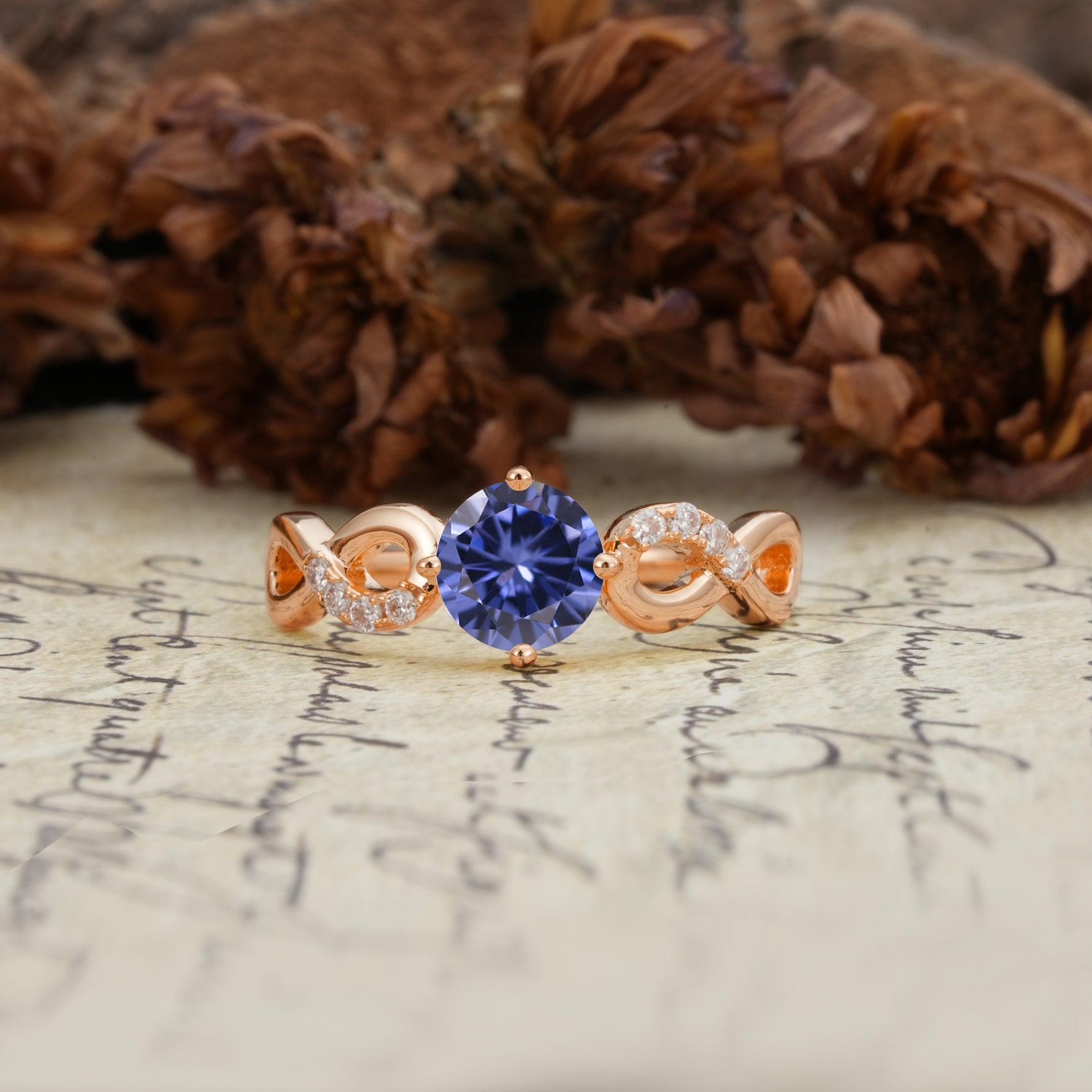 Unique, Luxurious, Twisted-Cross 4-Prong Round Cut Tanzanite Engagement Ring - Additional view