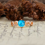Unique, Luxurious, Twisted-Cross 4-Prong Round Cut Turquoise Engagement Ring - Additional view