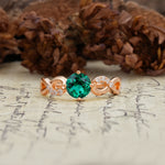 Unique, Luxurious, Twisted-Cross 4-Prong Round Cut Emerald Engagement Ring - Additional view