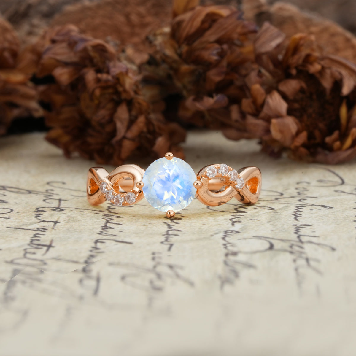 Unique, Luxurious, Twisted-Cross 4-Prong Round Cut Moonstone Engagement Ring - Additional view
