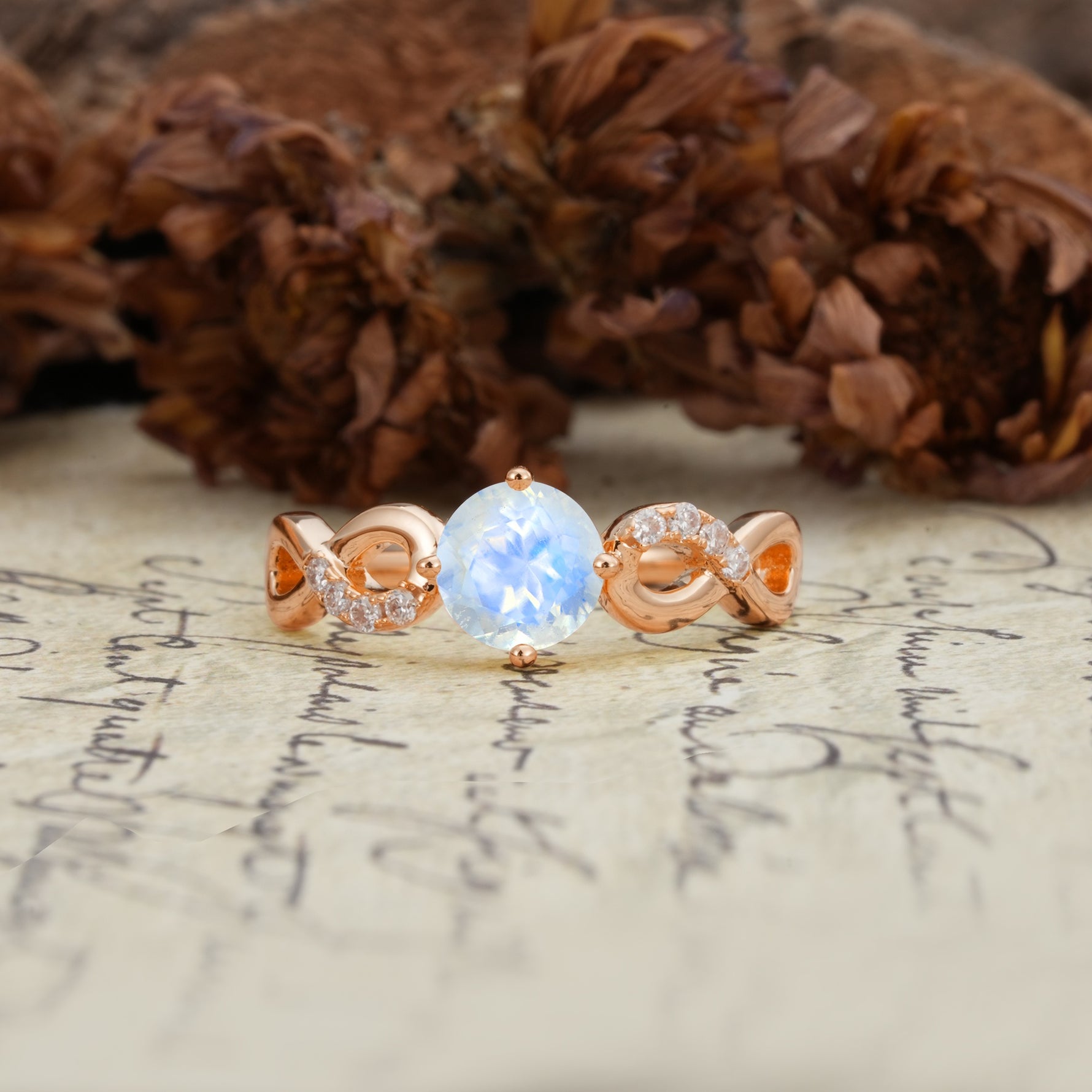 Unique, Luxurious, Twisted-Cross 4-Prong Round Cut Moonstone Engagement Ring - Additional view