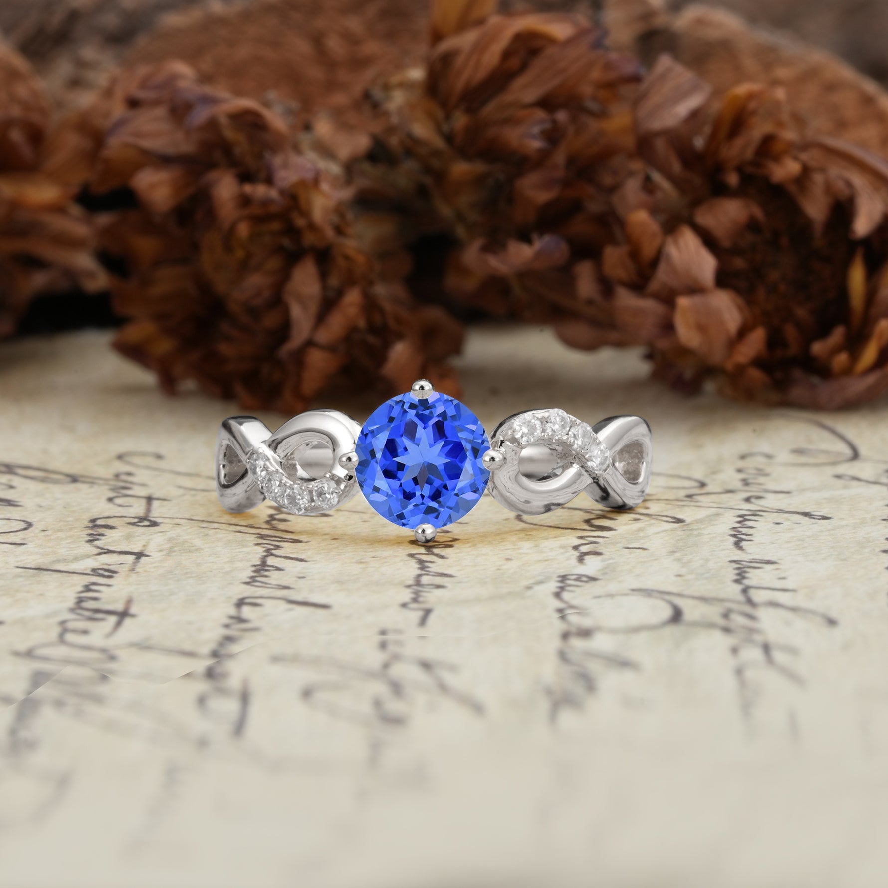 Unique, Luxurious, Twisted-Cross 4-Prong Round Cut Sapphire Engagement Ring - Additional view