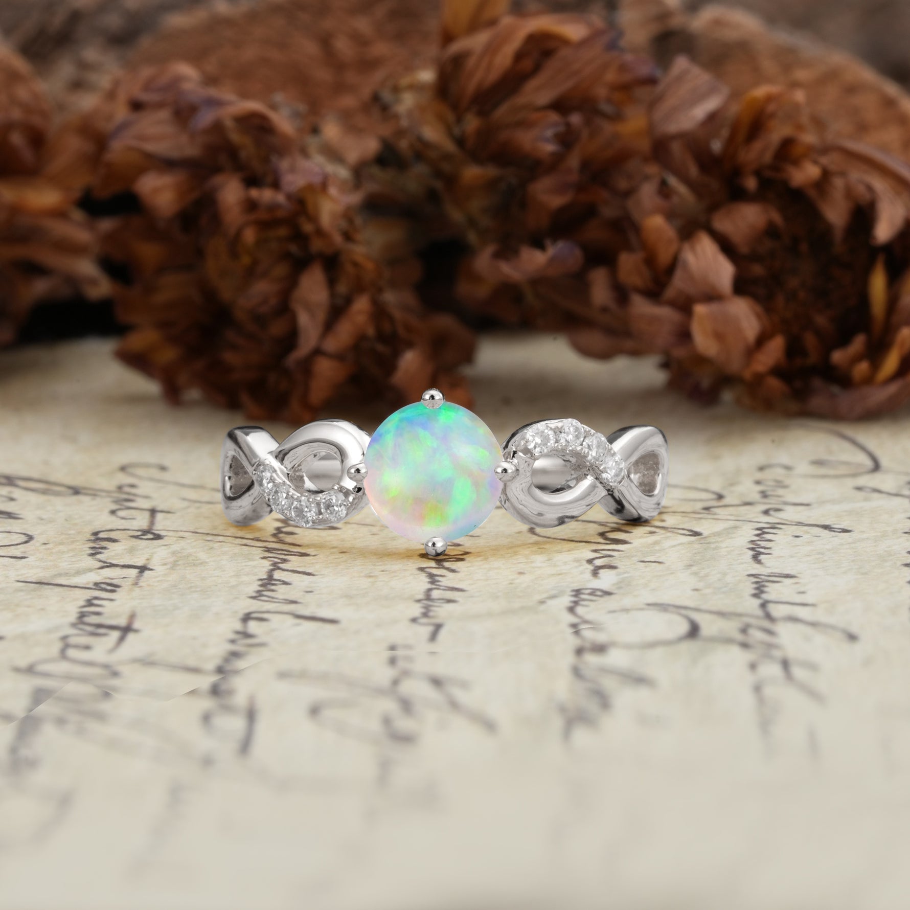 Unique, Luxurious, Twisted-Cross 4-Prong Round Cut Fire Opal Engagement Ring - Additional view