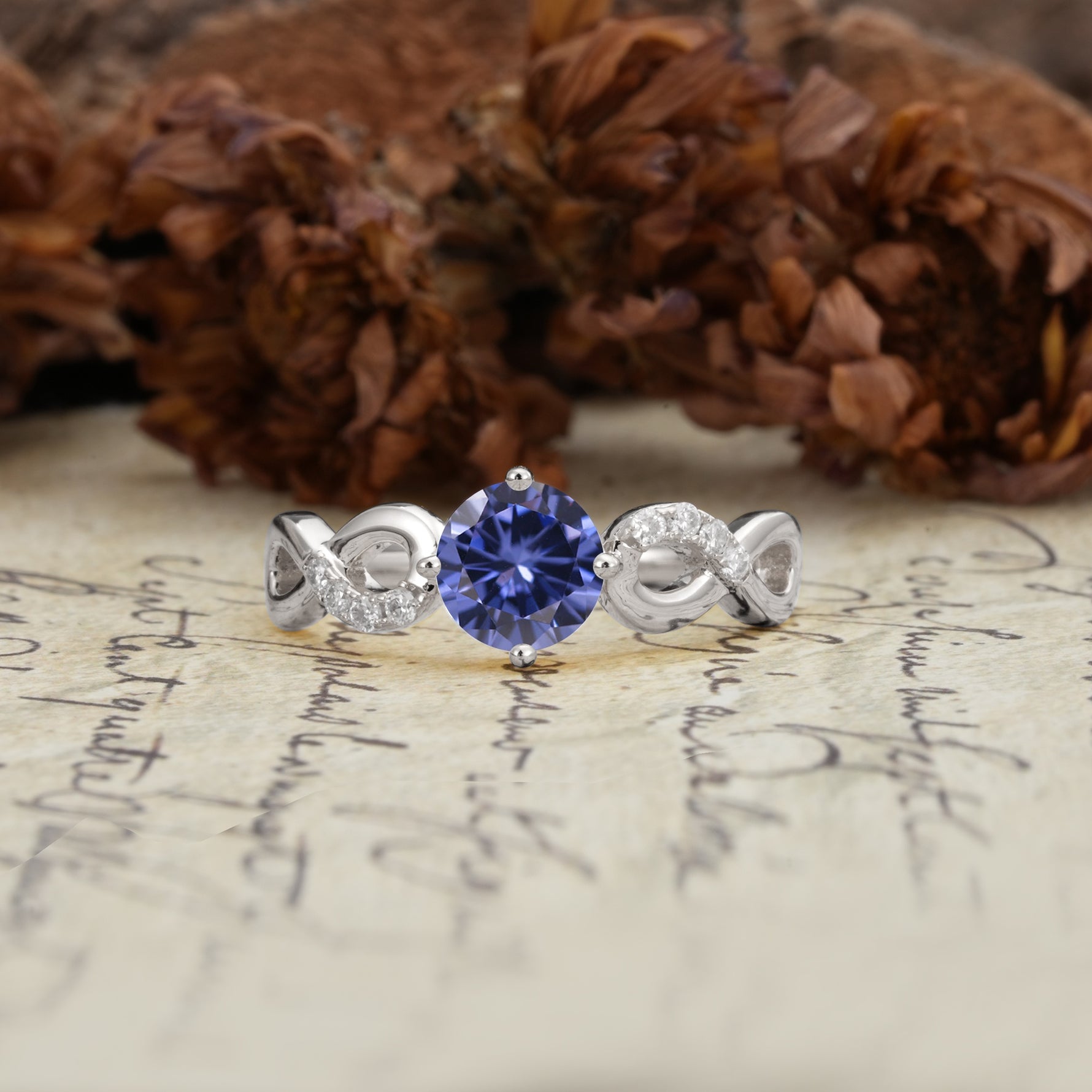 Unique, Luxurious, Twisted-Cross 4-Prong Round Cut Tanzanite Engagement Ring - Additional view