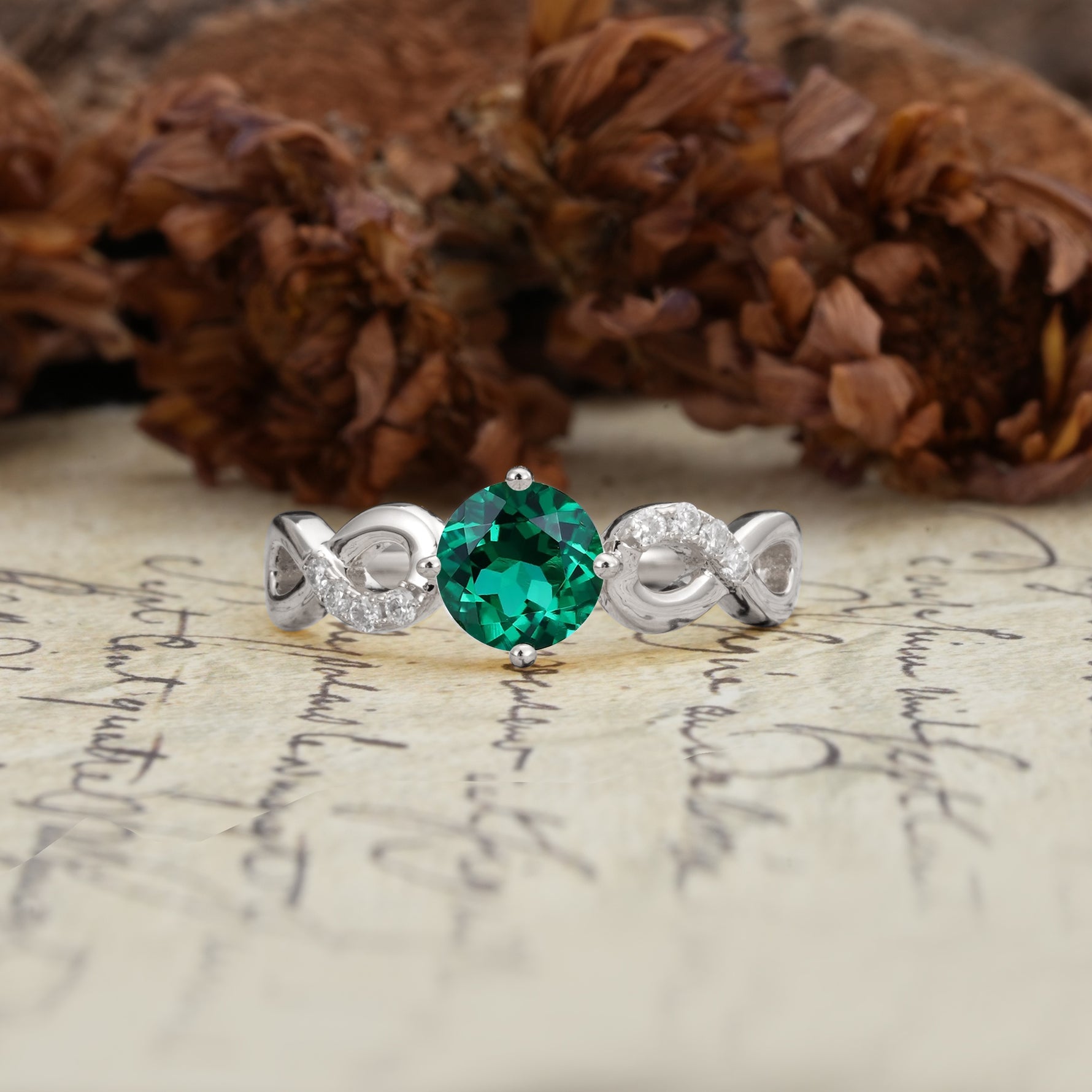 Unique, Luxurious, Twisted-Cross 4-Prong Round Cut Emerald Engagement Ring - Additional view