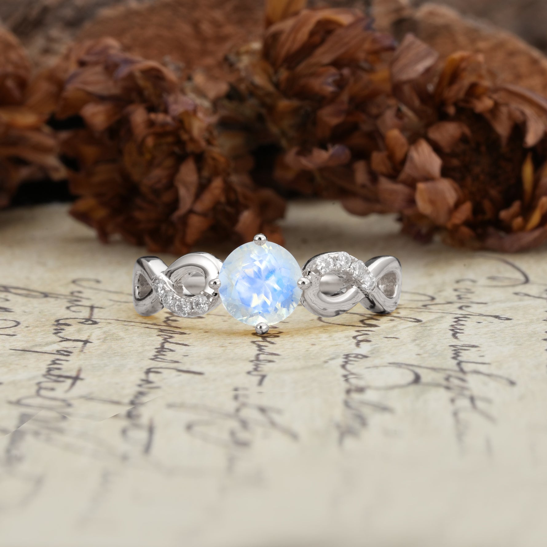 Unique, Luxurious, Twisted-Cross 4-Prong Round Cut Moonstone Engagement Ring - Additional view
