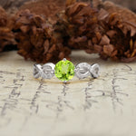 Unique, Luxurious, Twisted-Cross 4-Prong Round Cut Peridot Engagement Ring - Additional view