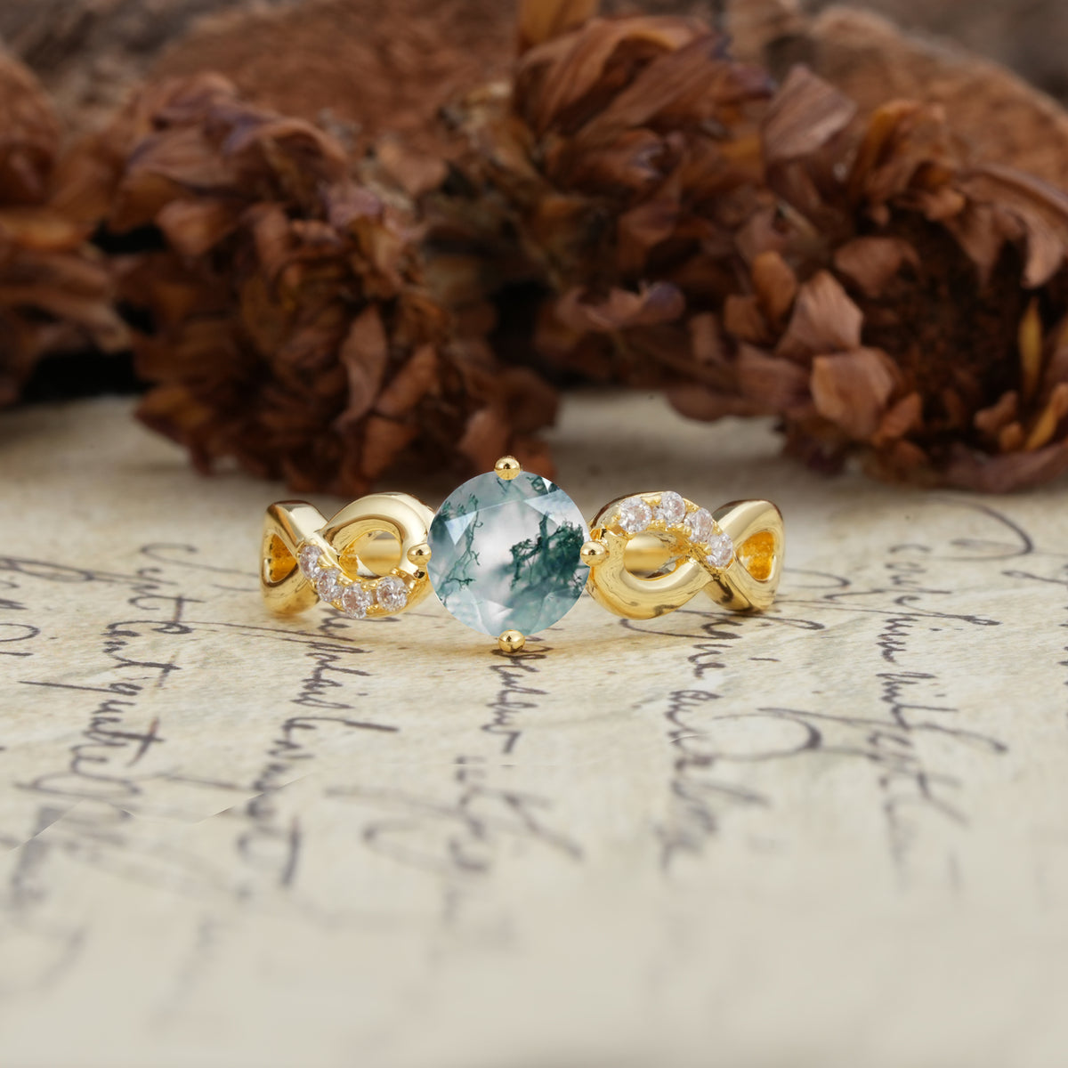 Unique, Luxurious, Twisted-Cross 4-Prong Round Cut Moss Agate Engagement Ring