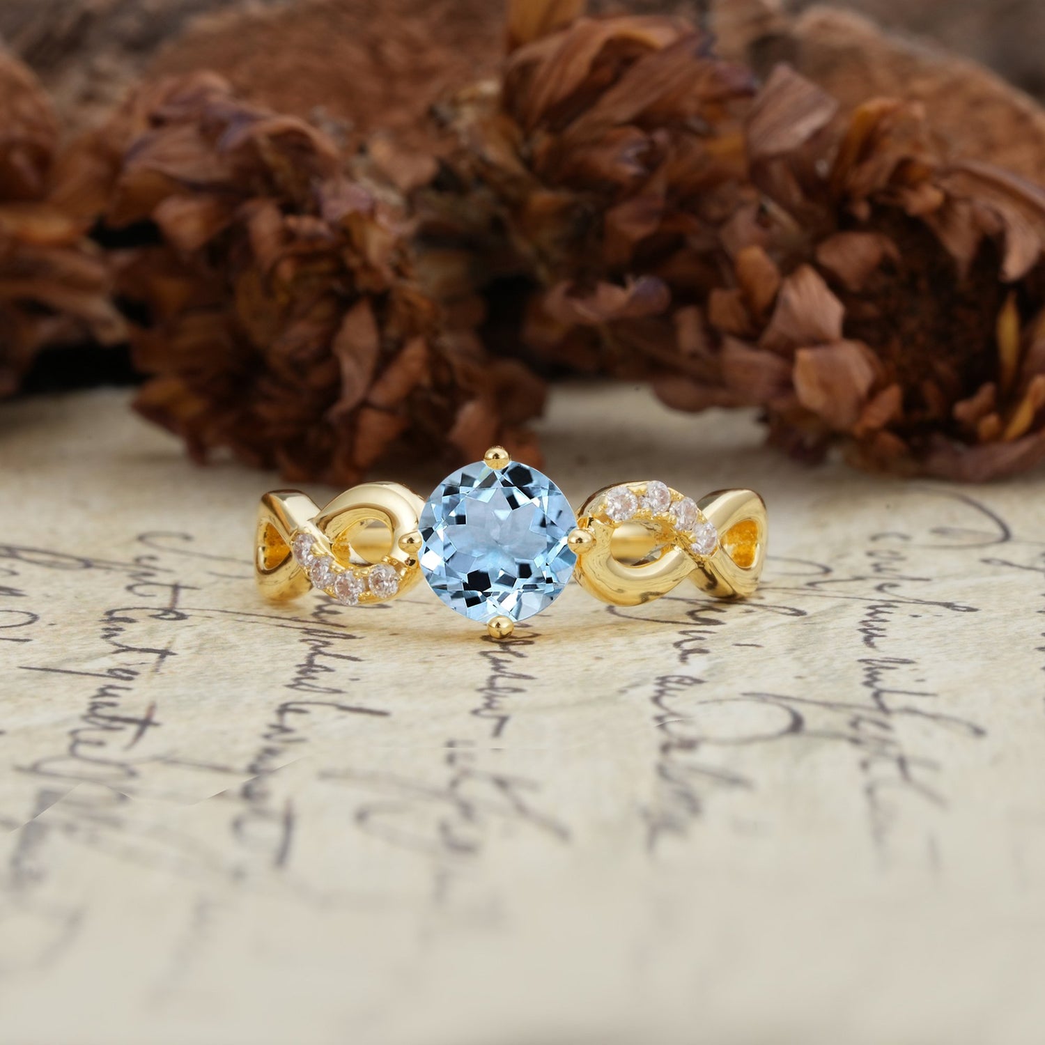 Unique, Luxurious, Twisted-Cross 4-Prong Round Cut Aquamarine Engagement Ring