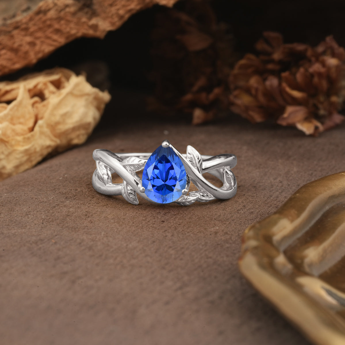 Nature-Inspired Classic Luxury: Entwined 3-Prong Pear Cut Sapphire Engagement Ring - Additional view