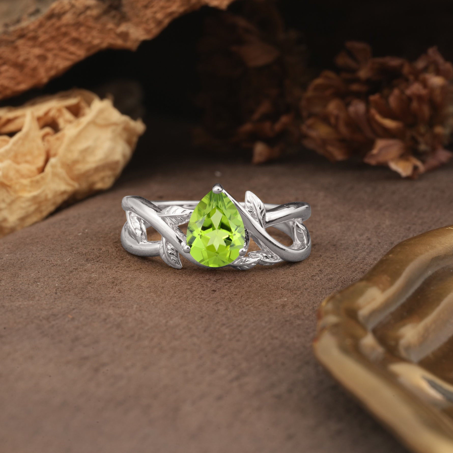 Nature-Inspired Classic Luxury: Entwined 3-Prong Pear Cut Peridot Engagement Ring - Additional view