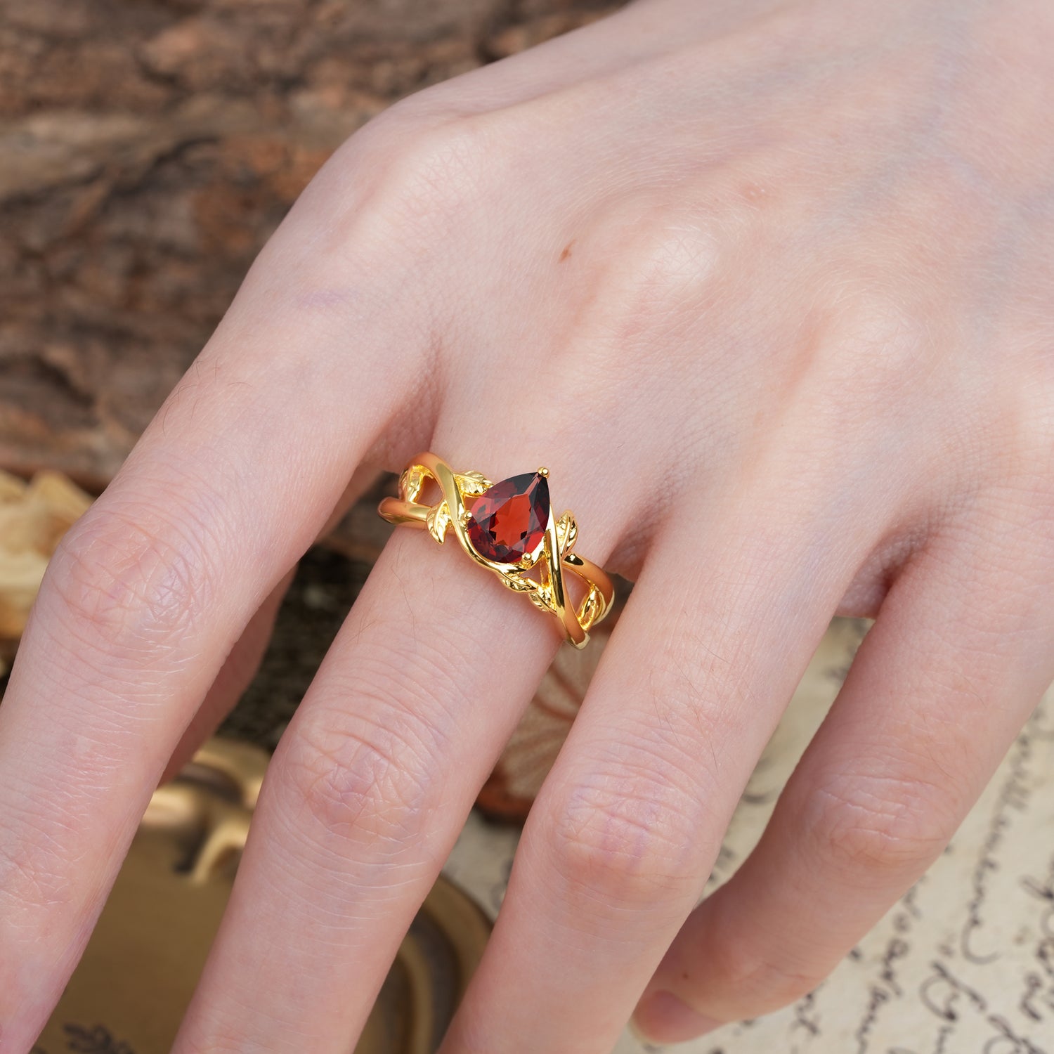 Nature-Inspired Classic Luxury: Entwined 3-Prong Pear Cut Garnet Engagement Ring