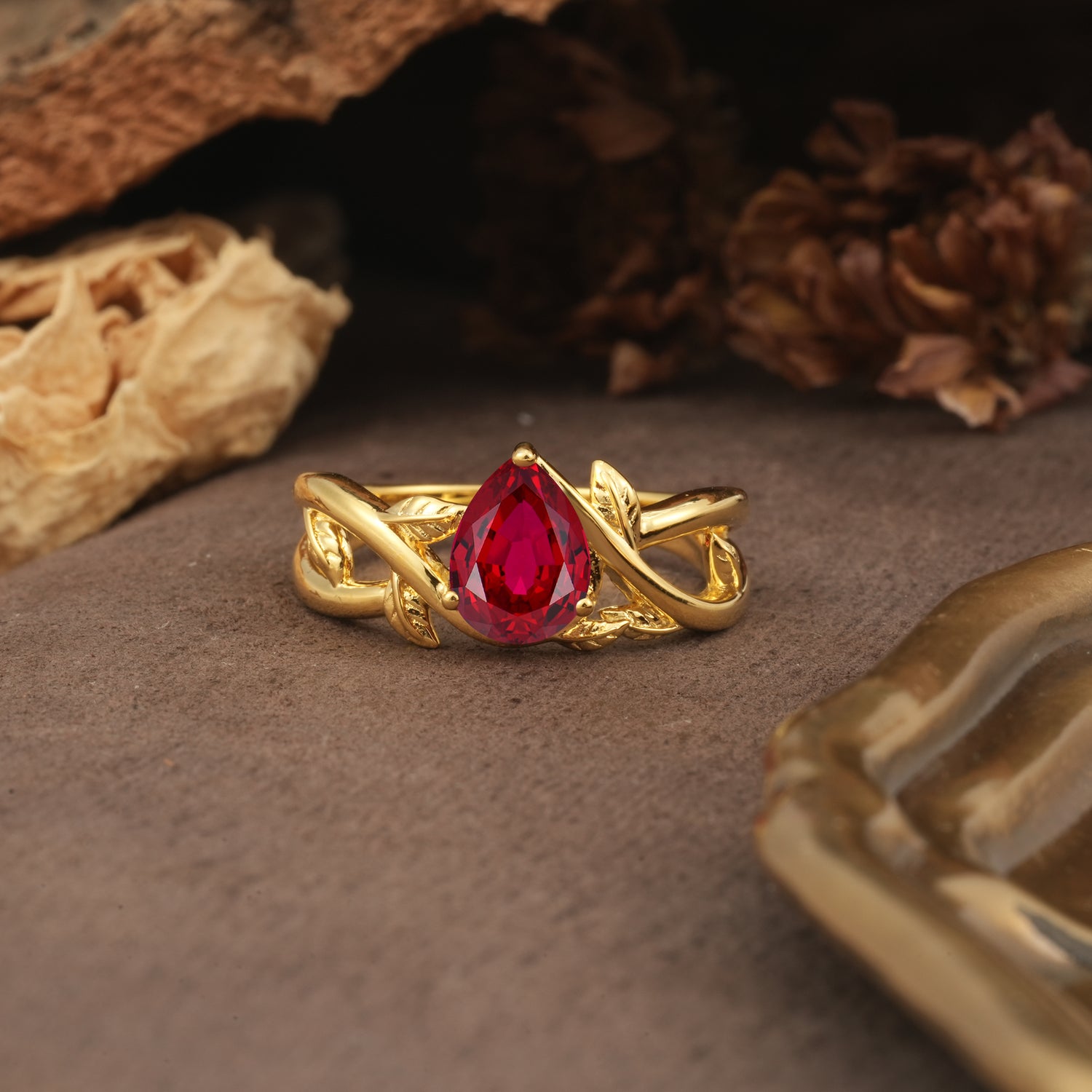 Nature-Inspired Classic Luxury: Entwined 3-Prong Pear Cut Ruby Engagement Ring