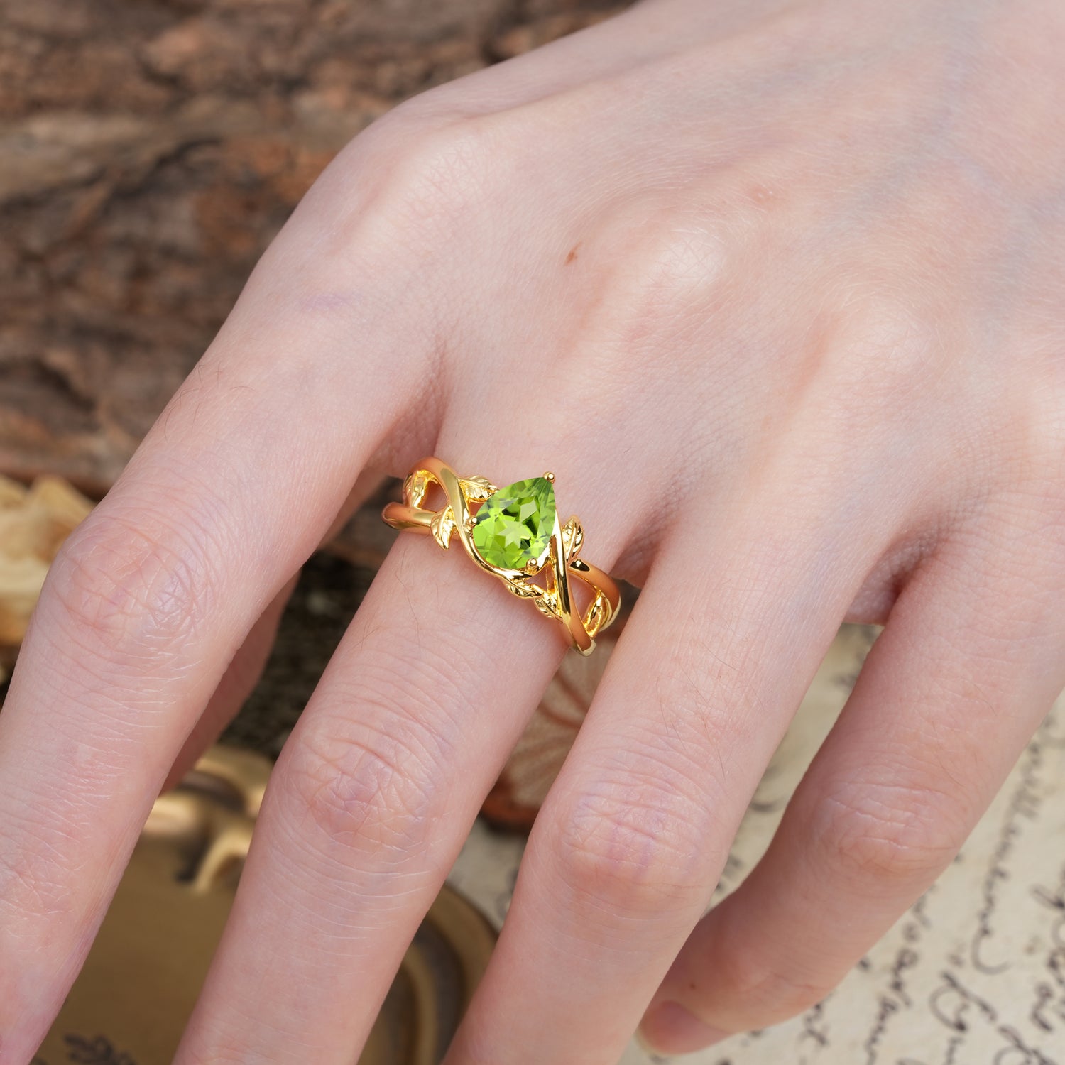 Nature-Inspired Classic Luxury: Entwined 3-Prong Pear Cut Peridot Engagement Ring