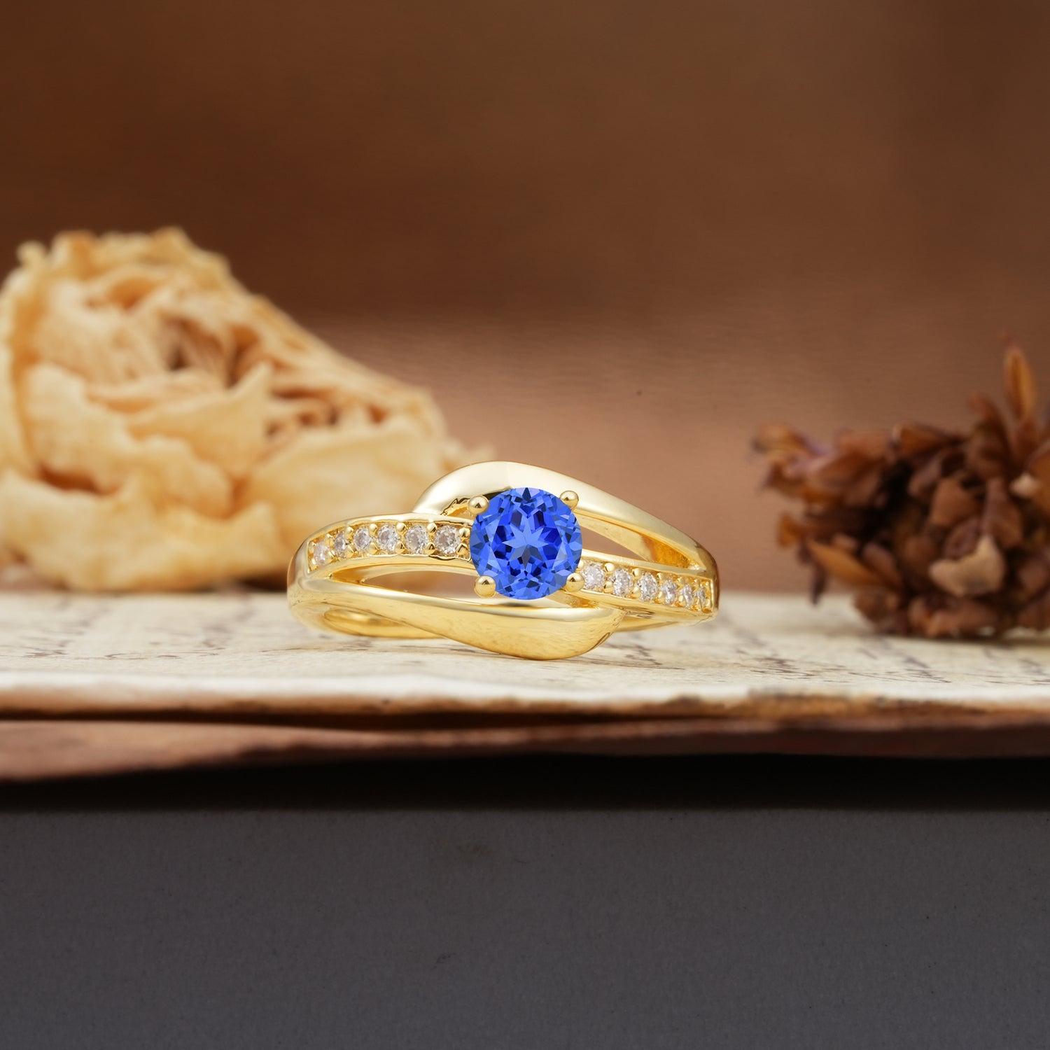Unique Intertwined 4-Prong Round Cut Sapphire Engagement Ring