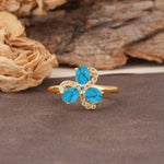 Unique Windmill-Flower Shape, 2-Prong Oval Cut Turquoise Wedding Ring - Additional view