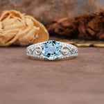 Luxurious and Unique, Entwined 4-Prong Round Cut Aquamarine Engagement Ring - Additional view