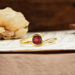Unique, Minimalist, and Intertwined Round Cut Garnet Engagement Ring - Additional view