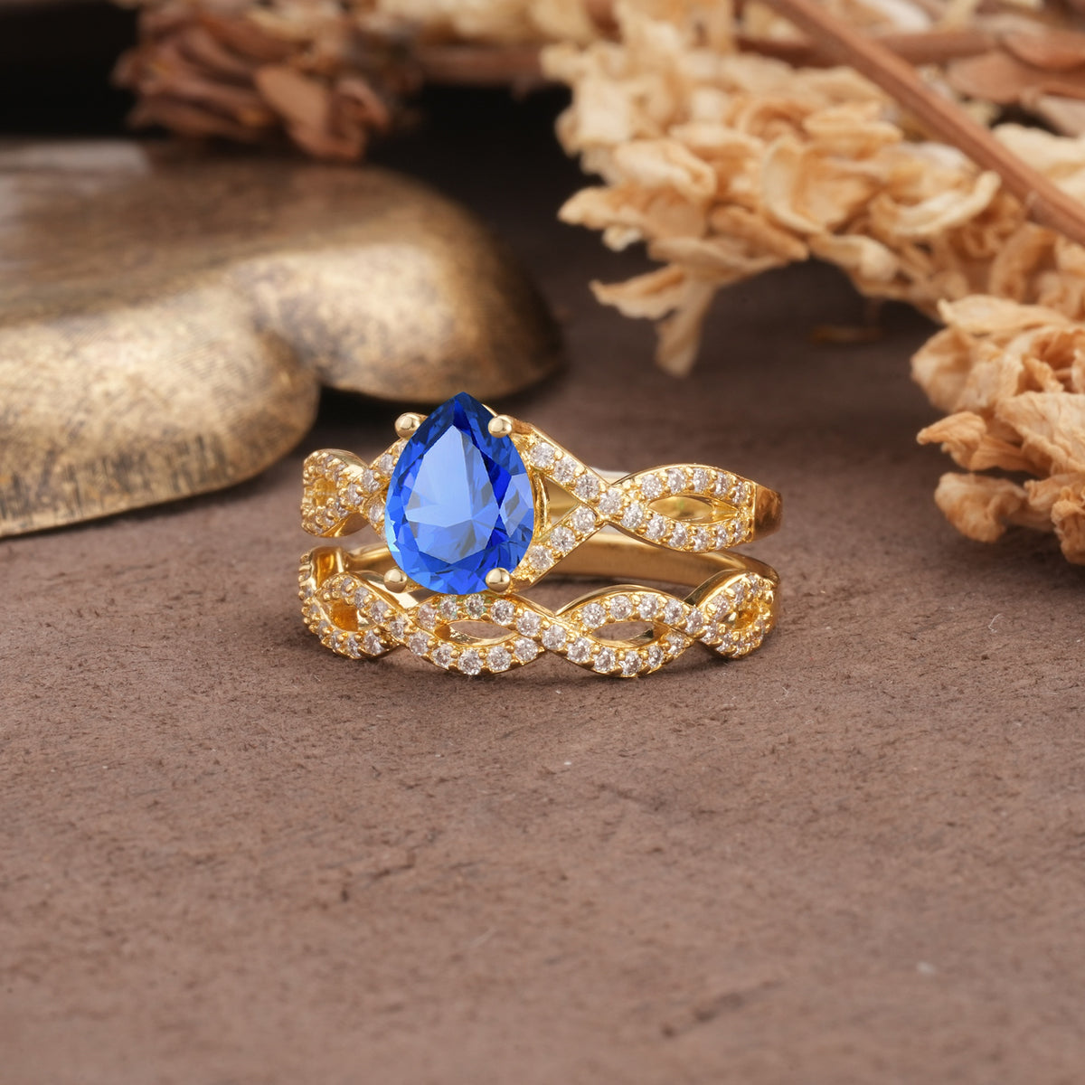 Luxurious and Unique: Entwined 4-Prong Pear Cut Sapphire Bridal Ring Set - White-Gold