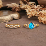 Luxurious and Unique: Entwined 4-Prong Pear Cut Turquoise Bridal Ring Set - Additional view