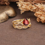 Luxurious and Unique: Entwined 4-Prong Pear Cut Garnet Bridal Ring Set - Rose-Gold