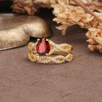 Luxurious and Unique: Entwined 4-Prong Pear Cut Garnet Bridal Ring Set - White-Gold