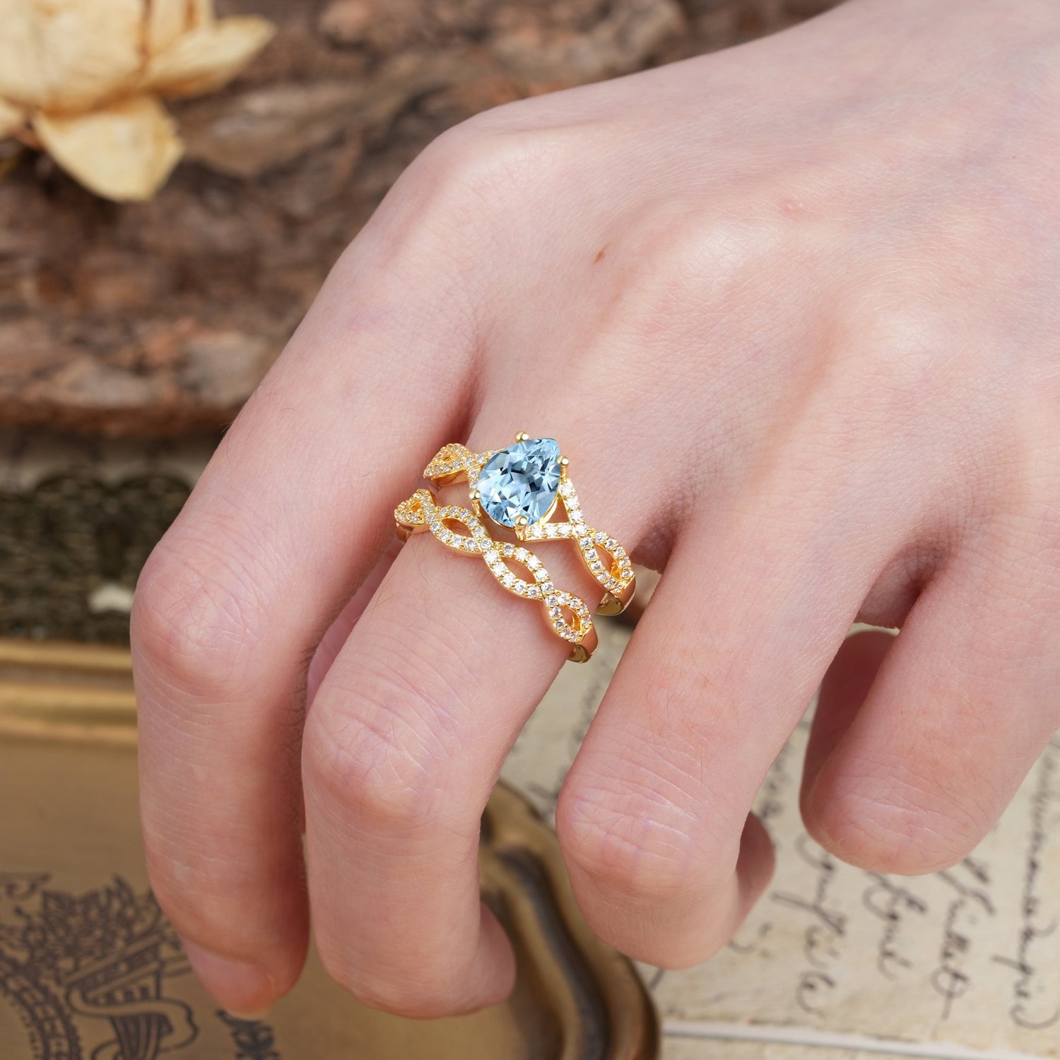 Luxurious and Unique: Entwined 4-Prong Pear Cut Aquamarine Bridal Ring Set
