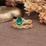Luxurious and Unique: Entwined 4-Prong Pear Cut Emerald Bridal Ring Set - White-Gold