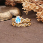 Luxurious and Unique: Entwined 4-Prong Pear Cut Moonstone Bridal Ring Set - White-Gold
