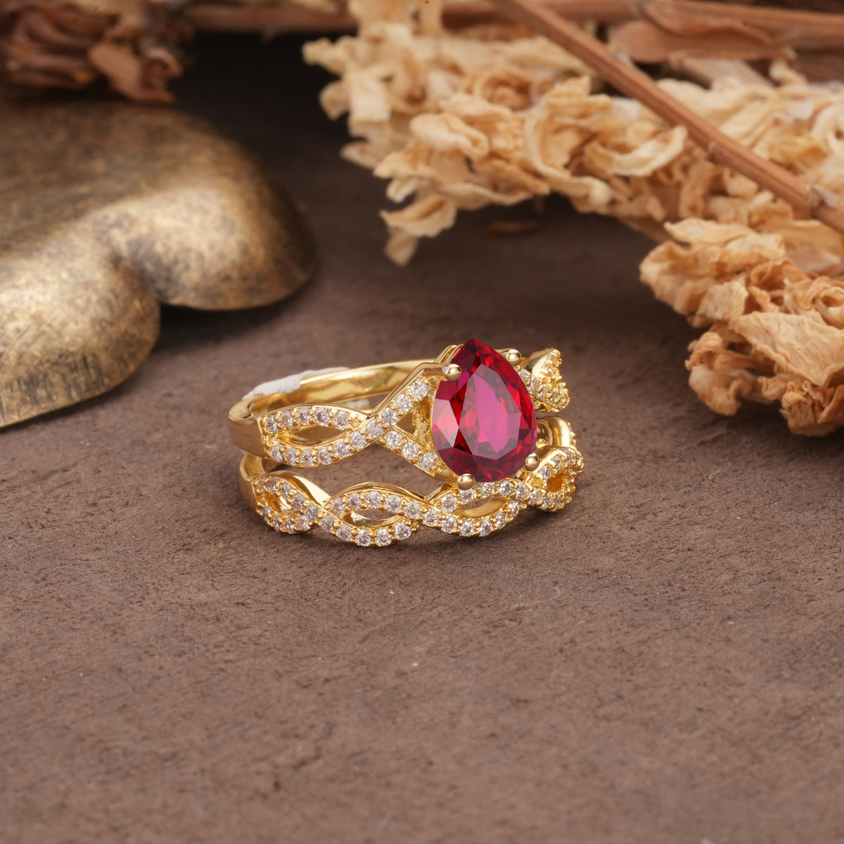 Luxurious and Unique: Entwined 4-Prong Pear Cut Ruby Bridal Ring Set - Rose-Gold