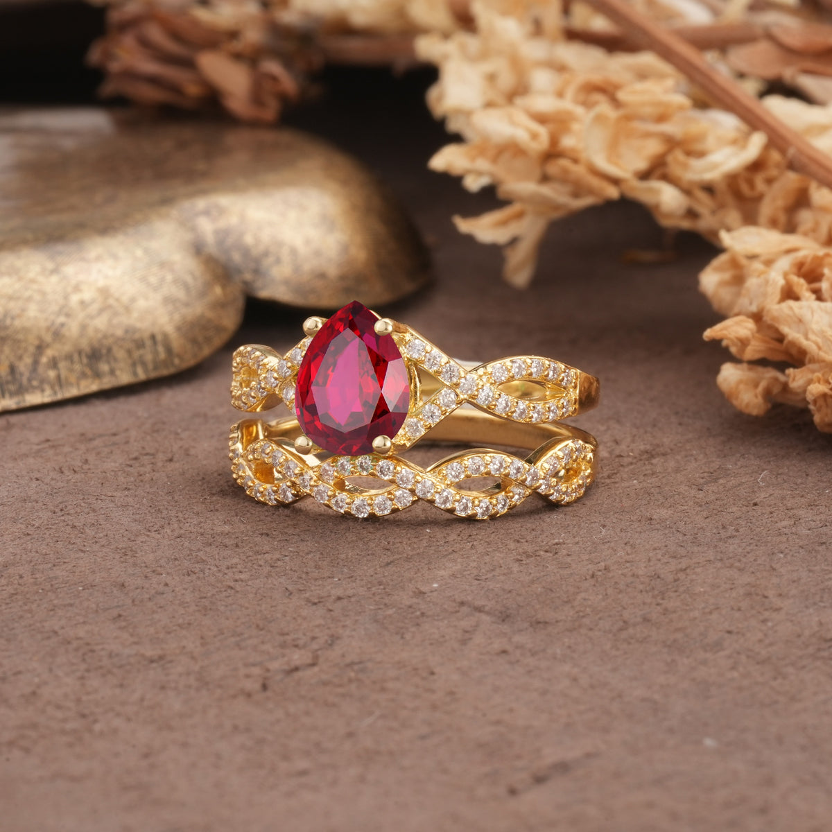 Luxurious and Unique: Entwined 4-Prong Pear Cut Ruby Bridal Ring Set - White-Gold