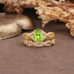 Luxurious and Unique: Entwined 4-Prong Pear Cut Peridot Bridal Ring Set - Yellow-Gold