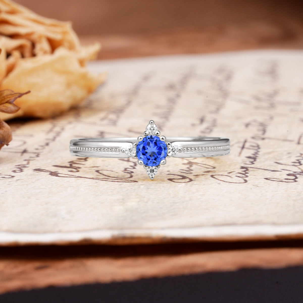 Simple 4-Prong Round Cut Sapphire Side Stone Engagement Ring - Additional view