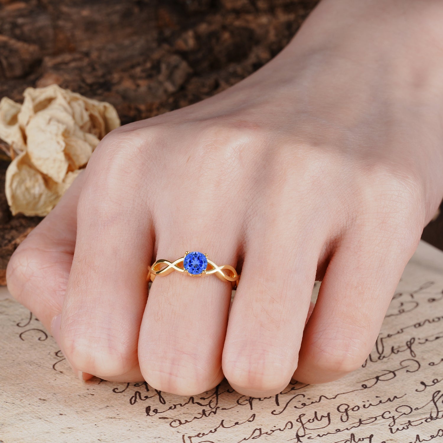 Classic, Minimalist, Twisted 4-Prong Round Cut Sapphire Engagement Ring