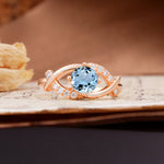 Unique and Luxurious 4-Prong Wrapped Round Cut Aquamarine Engagement Ring - Additional view
