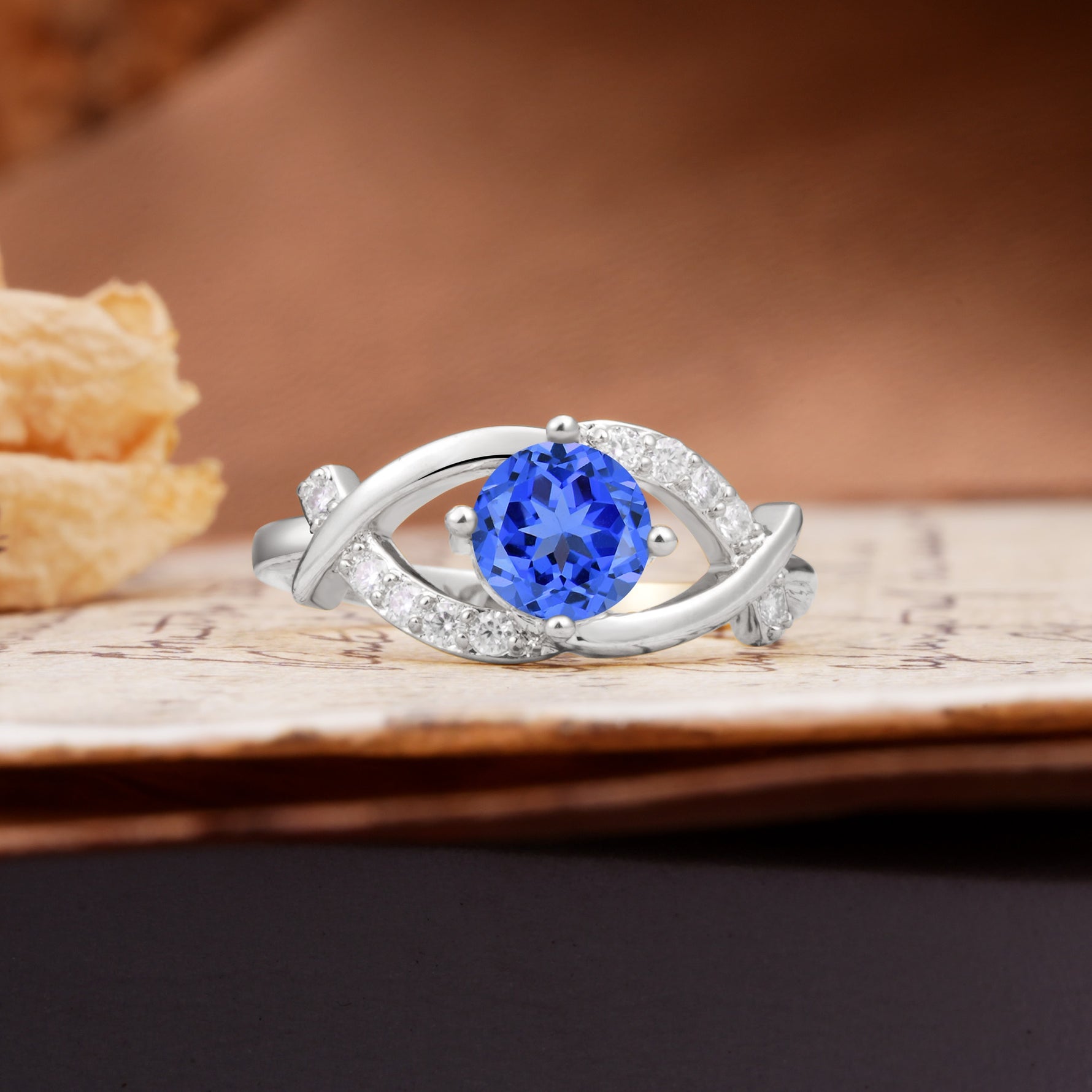 Unique and Luxurious 4-Prong Wrapped Round Cut Sapphire Engagement Ring - Additional view