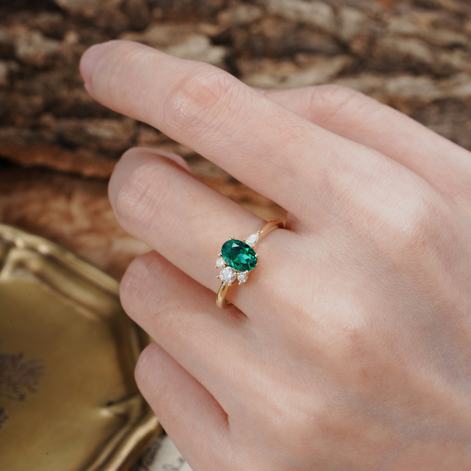 Unique & Classic 4-Prong Setting with Oval-Cut Side Stones Emerald Engagement Ring