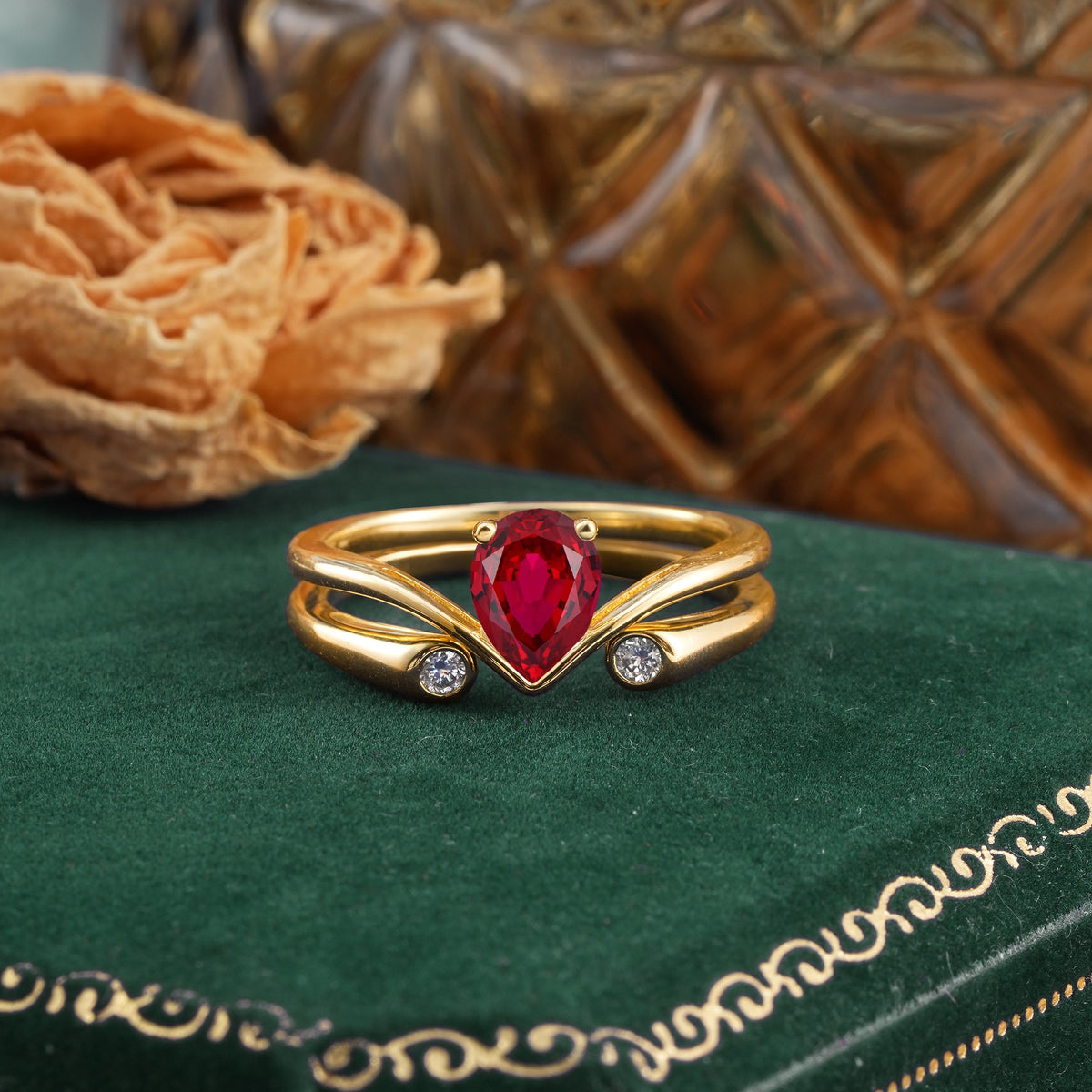 Elegant Pear Cut Ruby  with Curved Split Shank and Flanking Round Brilliant Accents Bridal Ring Set - Yellow-Gold