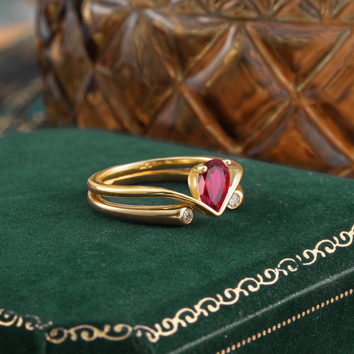 Elegant Pear Cut Ruby  with Curved Split Shank and Flanking Round Brilliant Accents Bridal Ring Set - Rose-Gold