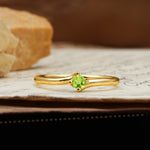 Classic and Minimalist 4-Prong Round-Cut Three-Stone Peridot Engagement Ring - Additional view