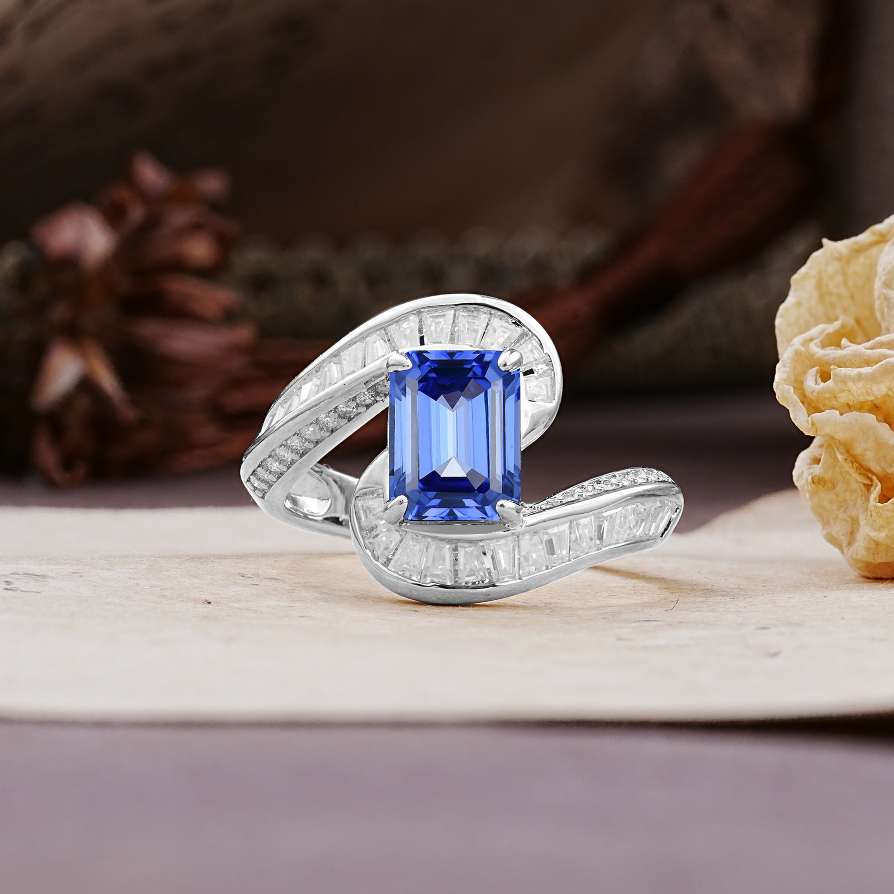 Unique Luxurious Twisted 4-Prong Emerald Cut Sapphire Engagement Ring - Additional view