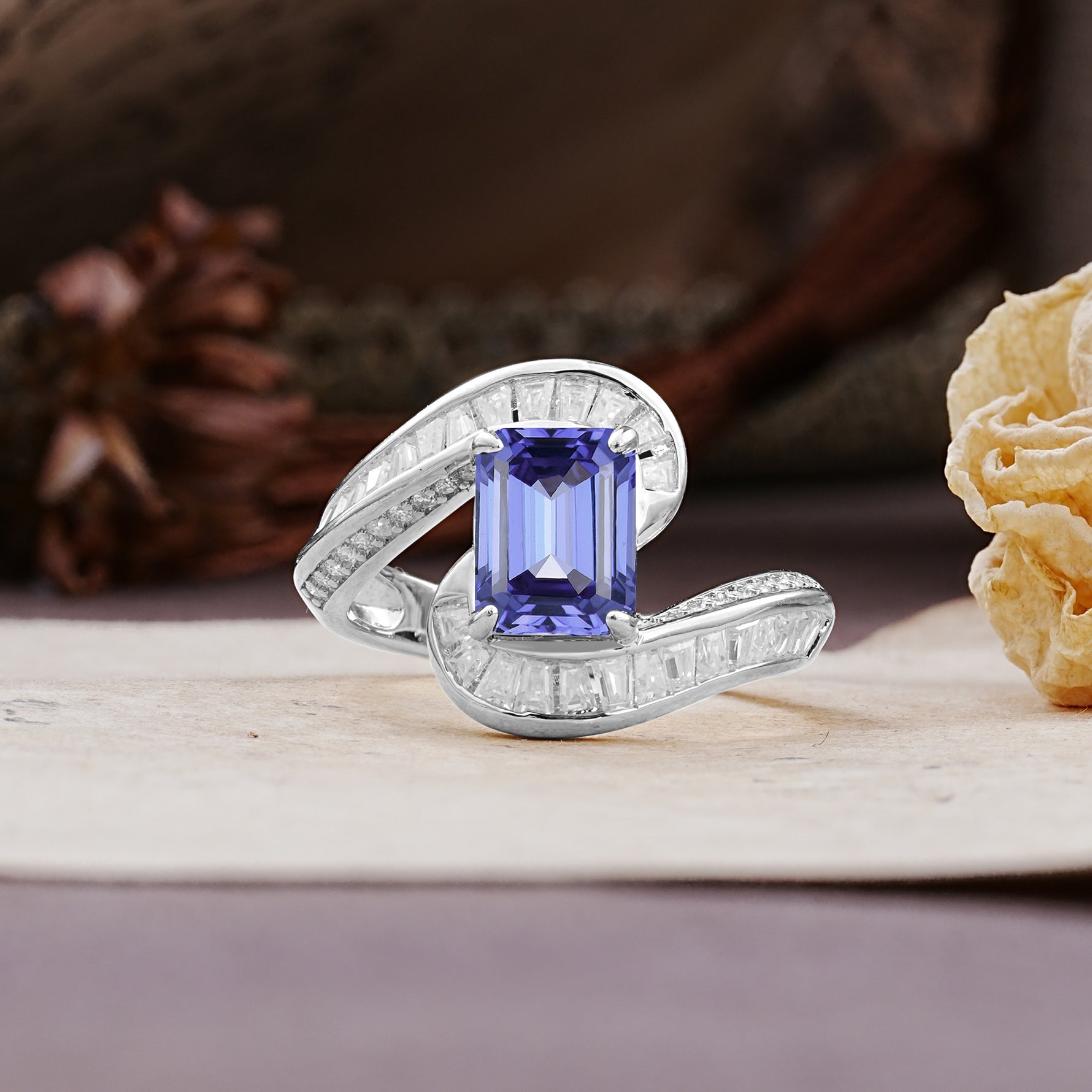 Unique Luxurious Twisted 4-Prong Emerald Cut Tanzanite Engagement Ring - Additional view