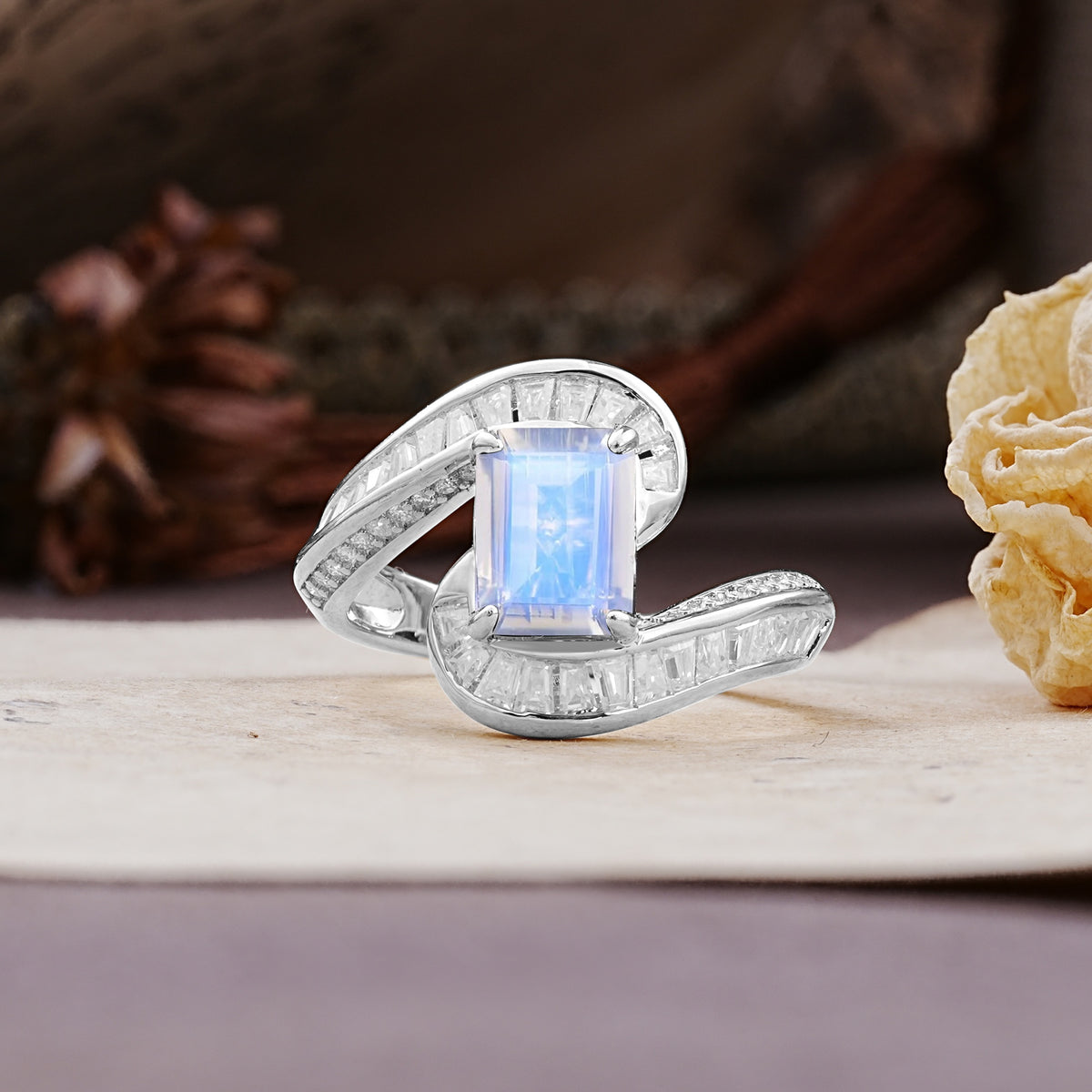 Unique Luxurious Twisted 4-Prong Emerald Cut Moonstone Engagement Ring - Additional view