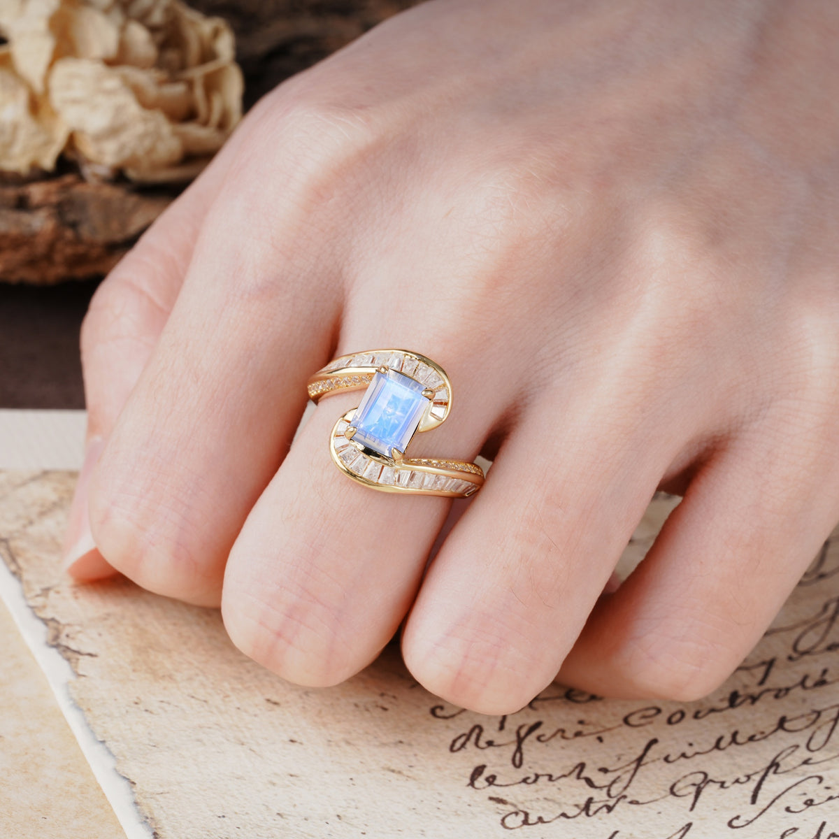 Unique Luxurious Twisted 4-Prong Emerald Cut Moonstone Engagement Ring - Additional view